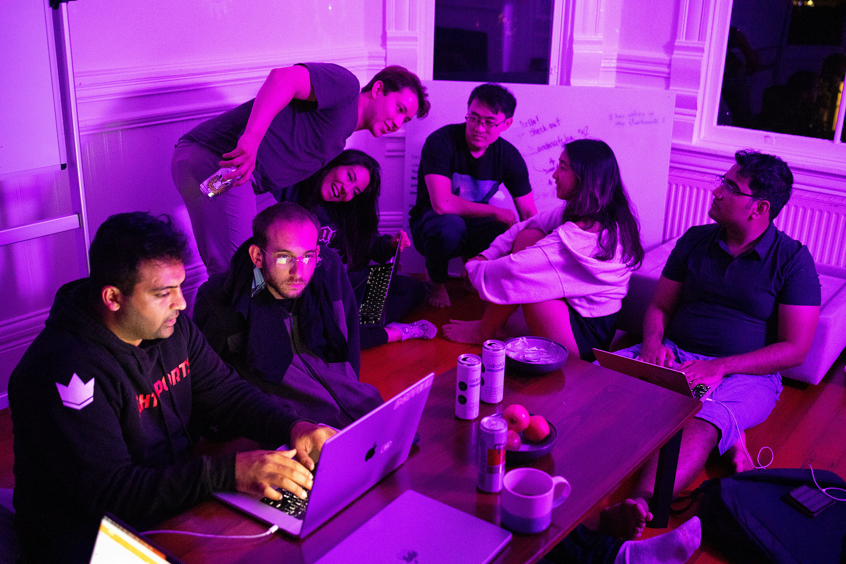 Aqeel Ali (left) and Kevin Baragona work while attending the “Ghosted in SF: Come Code it Off” event at the office of Exa, an AI powered search engine start-up, in San Francisco, Calif., on Saturday, September 30, 2023. The start-up invited friends and members of the AI community to come code at their place for the night after one of the company’s teammates got ghosted on a date the weekend before. They jokingly invited people to come over and work with them instead of wasting another Saturday night being ghosted. The company offices are located in an apartment many of the teammates live in and directly above the apartment housing another start-up, Brev.Dev., which has turned the building into a gathering spot for the AI community. 